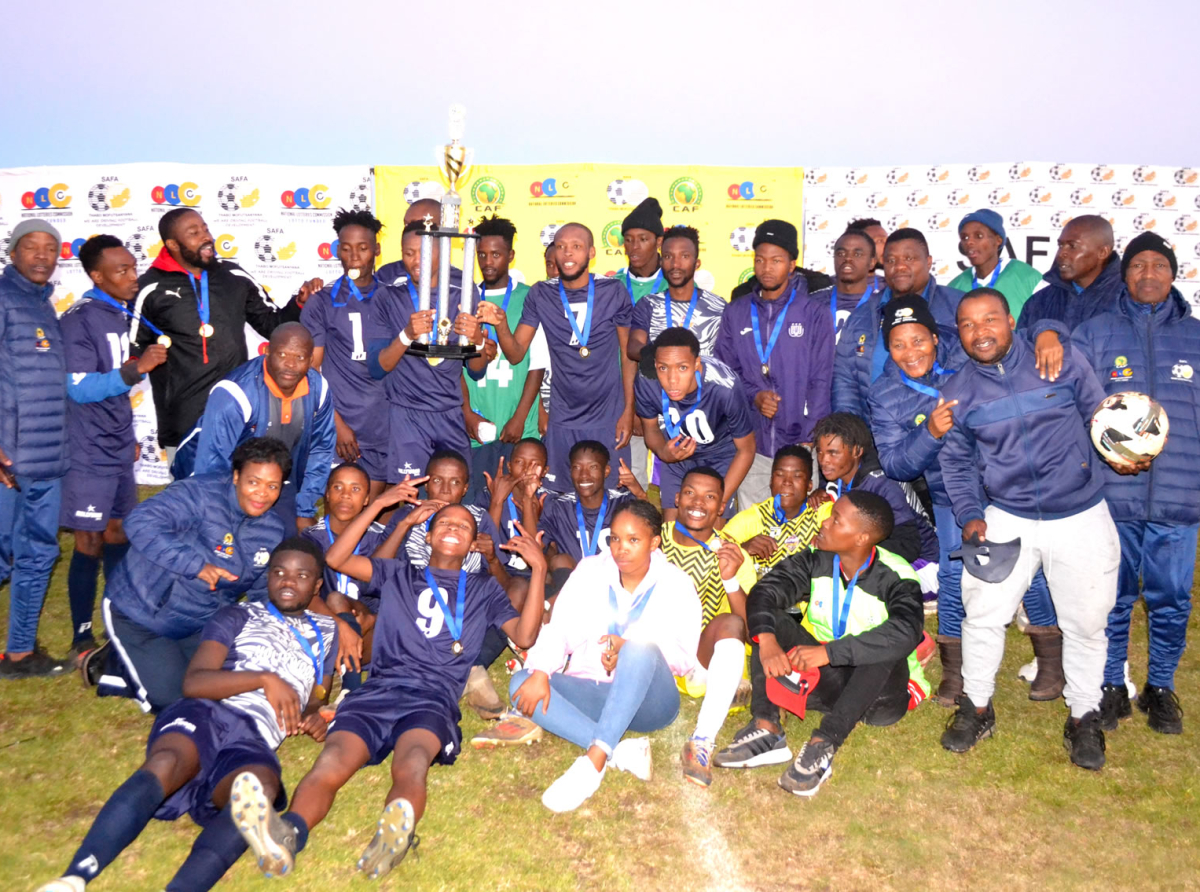 Tower United FC players and technical team lift the trophy after they won the Safa Thabo Mofutsanayana Hollywood Men's regional league playoffs In Fouriesburg.